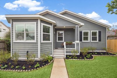 This charming home sits on a corner lot of a tree-lined street with fresh landscaping and ample curb appeal. | Image 2