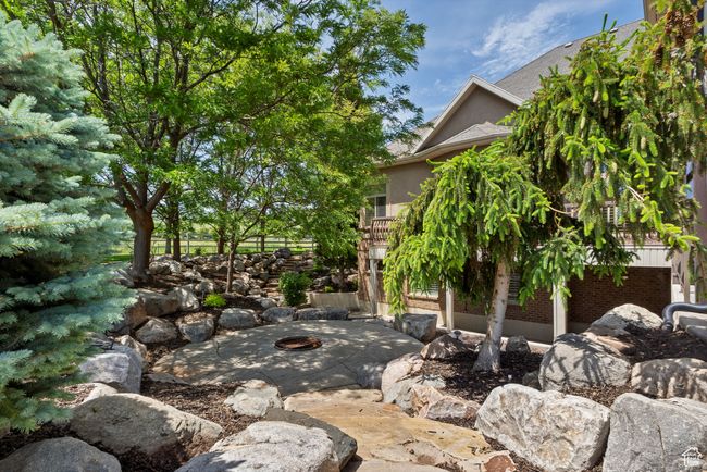 View of patio / terrace with an outdoor fire pit | Image 78
