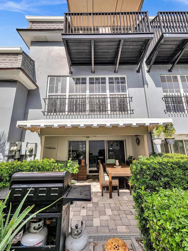 open air balcony above with shaded patio below | Image 72