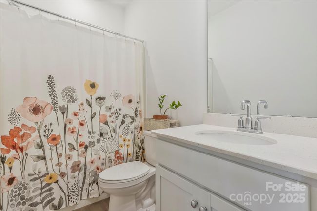 Full bath on the main level with linen closet. | Image 13