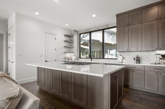 Gourmet kitchen with oversized Quartz island. | Image 6