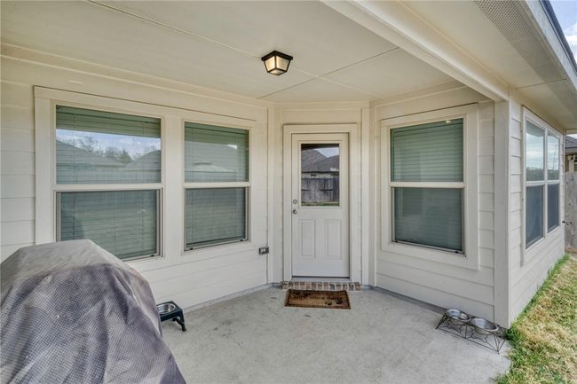 Entrance to property with a patio | Image 32
