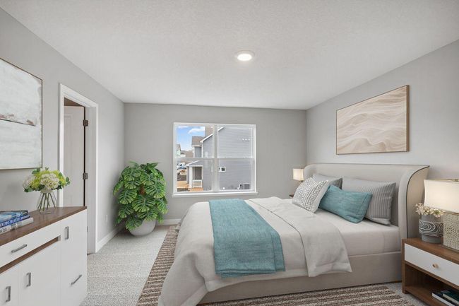Primary bedroom with walk-in closet and private bath. Model home. Options and colors will vary. | Image 21