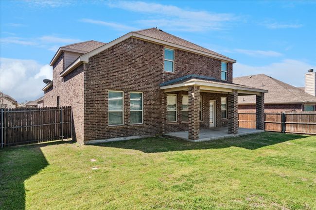 Back of property featuring brick, a fenced backyard, a patio area | Image 29