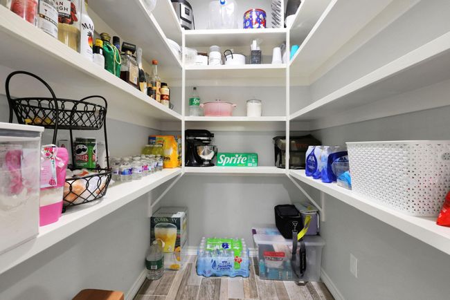 An oversized pantry offers abundant storage—perfect for the chef in the family and all your culinary essentials. | Image 22