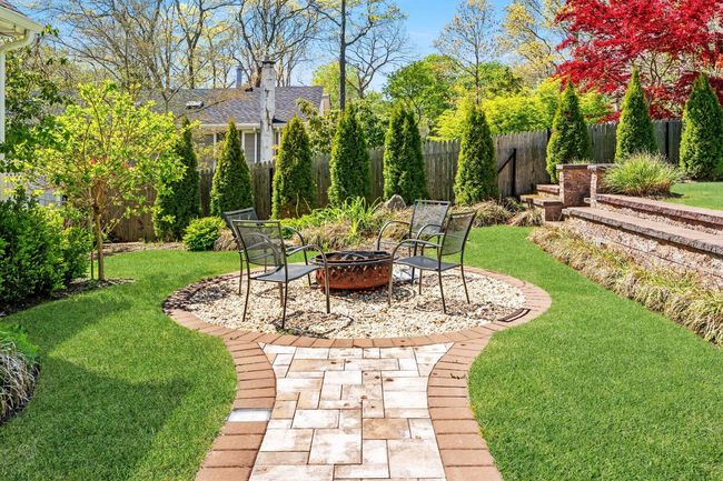 View of yard featuring a fire pit | Image 22