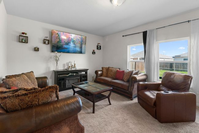 Living room featuring vaulted ceiling and carpet flooring | Image 17