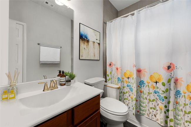 Bright and practical secondary bathroom with classic finishes and a layout designed for everyday convenience. *Virtually Staged | Image 17