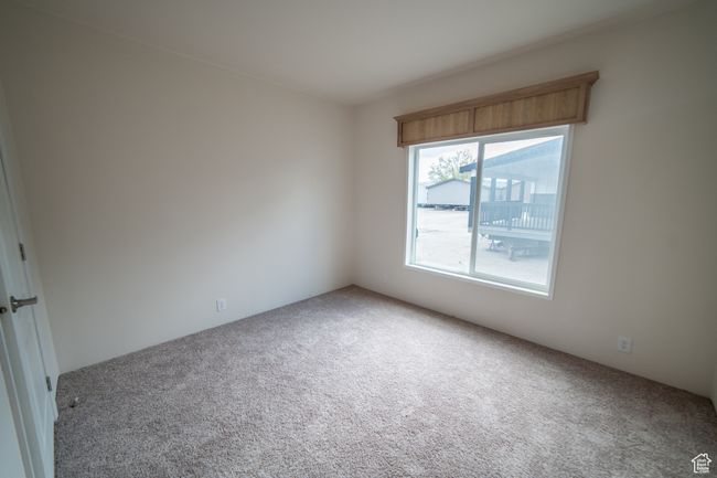 Unfurnished room featuring carpet | Image 64