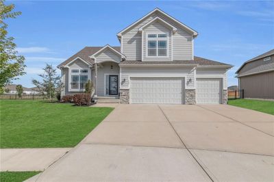 View of front of house with a front yard and a garage | Image 2