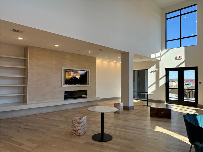 Building lobby with a towering ceiling and recessed lighting | Image 16