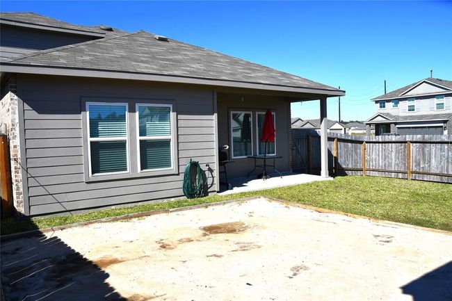 Backyard has a sandbox, for children to play or for above ground pool. | Image 47