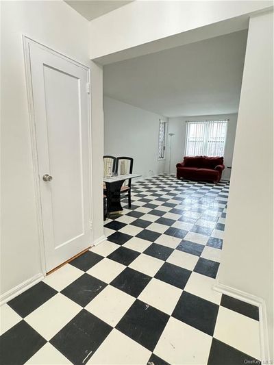 Hall featuring light tile patterned floors | Image 2