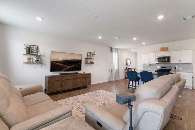 Living room featuring wood finished floors and recessed lighting | Image 16