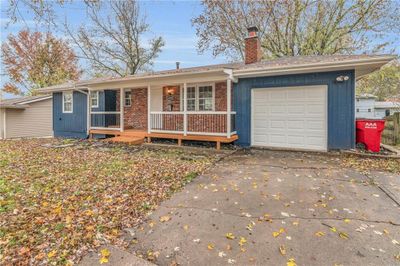 Single story home with covered porch and a garage | Image 3