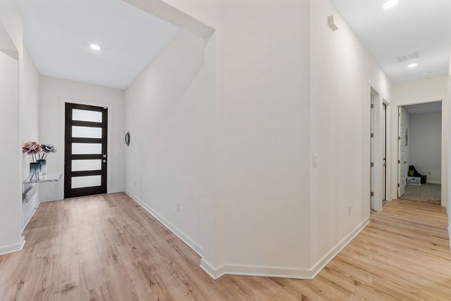 Foyer entrance featuring light wood finished floors, visible vents, recessed lighting, and baseboards | Image 9