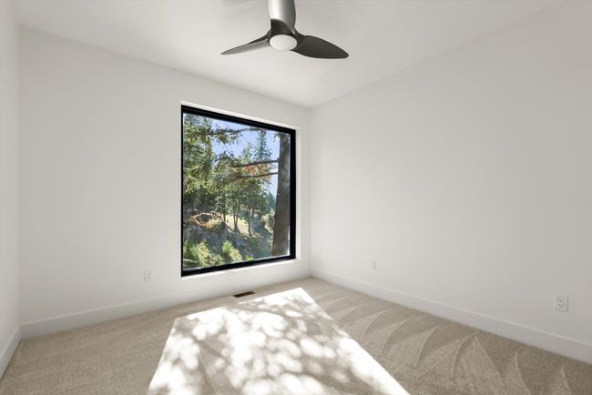 Bedroom on second-level with large window | Image 35
