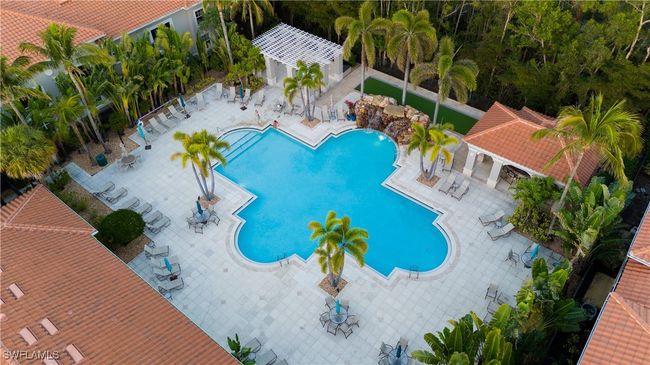 Community pool with a patio | Image 22