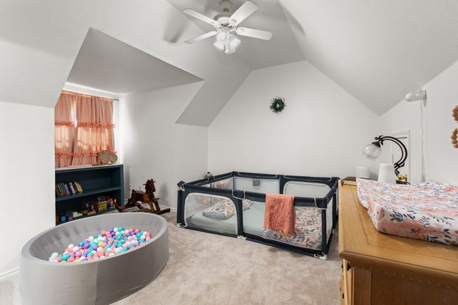 Secondary bedroom with vaulted ceilings | Image 26