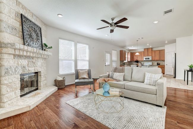 A corner fireplace warms the house on a cold winter day | Image 13