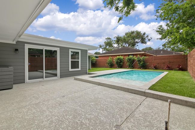 The patio is perfect for your backyard outings and entertaining. There is also plenty of room for lounging by the pool. | Image 27