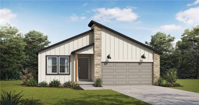 View of front of home with a front lawn and a garage | Image 1