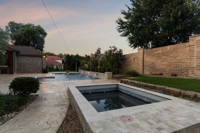 Beautiful view of pool and spa oasis | Image 38