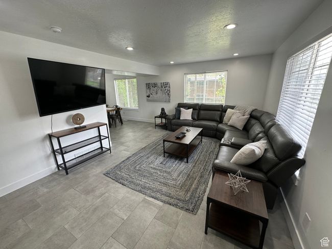 Living area with recessed lighting, baseboards, and a textured ceiling | Image 18