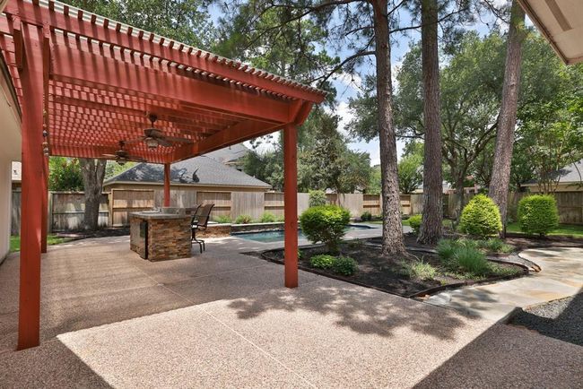 Looking for a zen feeling backyard...this is it! Pergola with outdoor grilling area with sink and bar refrigerator. | Image 34