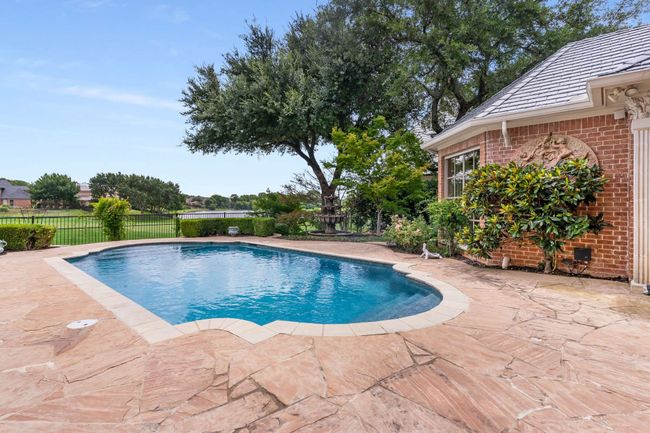 View of pool featuring a patio | Image 37