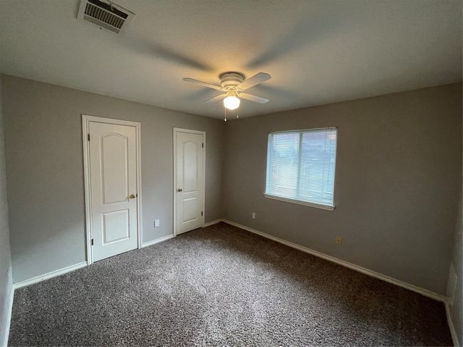 Unfurnished bedroom featuring carpet and ceiling fan | Image 13