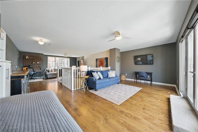 Living room with ceiling fan, baseboards, and wood finished floors | Image 30