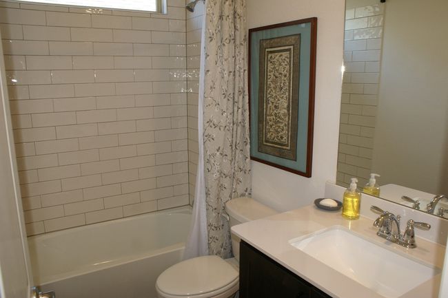 Bathroom featuring shower / bath combination ceramic tile shower | Image 7
