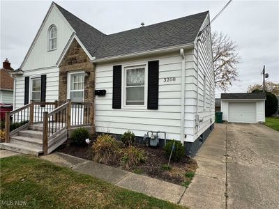 Bungalow-style home with an outbuilding and a garage | Image 2