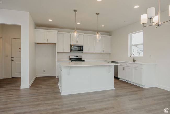 Spacious kitchen featuring stainless steel appliances. | Image 4