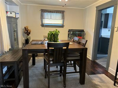 Dining room featuring crown molding and hardwood / wood-style flooring | Image 3