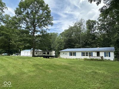 This home has plenty of room for everyone....conveniently located for easy access to Monrovia and I-70. Space for a garden, and mature trees adorn the property. | Image 1