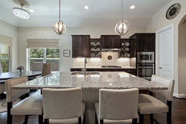 Oversized granite kitchen countertop perfect for seating and entertaining | Image 7