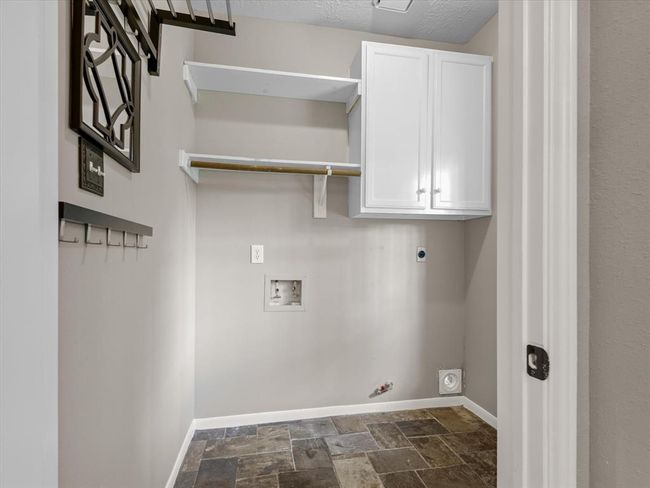 Inside laundry with both gas and electric hookups! Plenty of storage space as well! | Image 31