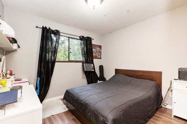 Bedroom with light wood-style floors | Image 23