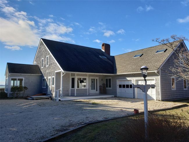 pebble approach with plenty of parking covered porch and 2 car garage | Image 14