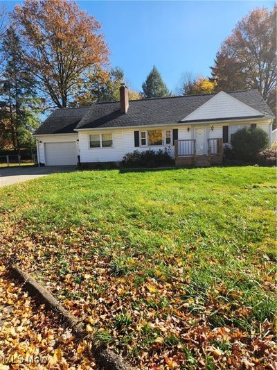 Single story home with a garage and a front yard | Image 1