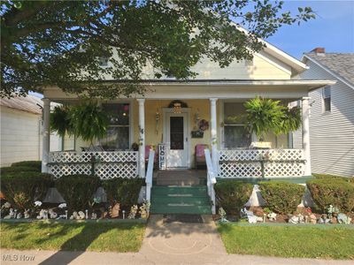 View of front of house featuring covered porch | Image 1