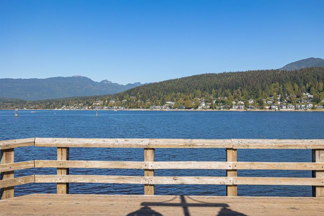 Dock area featuring a forest view and a water and mountain view | Image 28