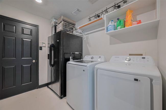 Laundry room with brand new washer and dryer | Image 12