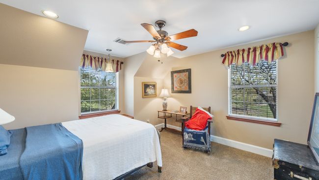 Bedroom featuring carpet flooring, baseboards, visible vents, ceiling fan, and recessed lighting | Image 26