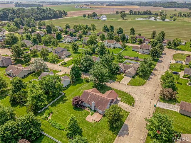 Aerial view of residential area featuring a nearby body of water | Image 33