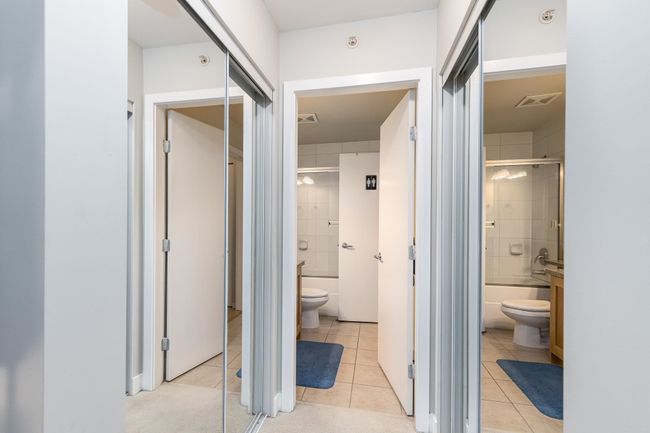 Hallway featuring visible vents and light tile patterned flooring | Image 22