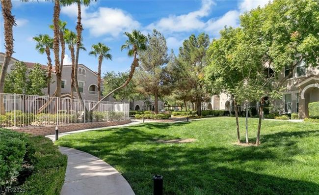 View of home's community featuring a lawn and fence | Image 20