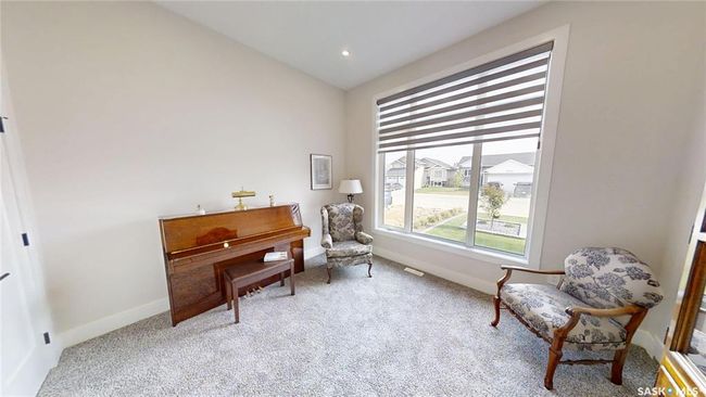 Sitting room with carpet flooring and vaulted ceiling | Image 14